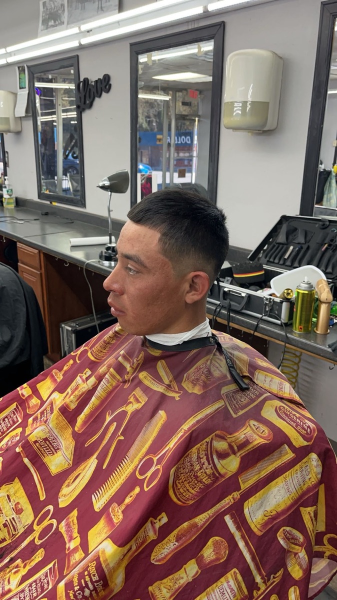 Clean fade haircut on a client at Blend Addicts Barbershop