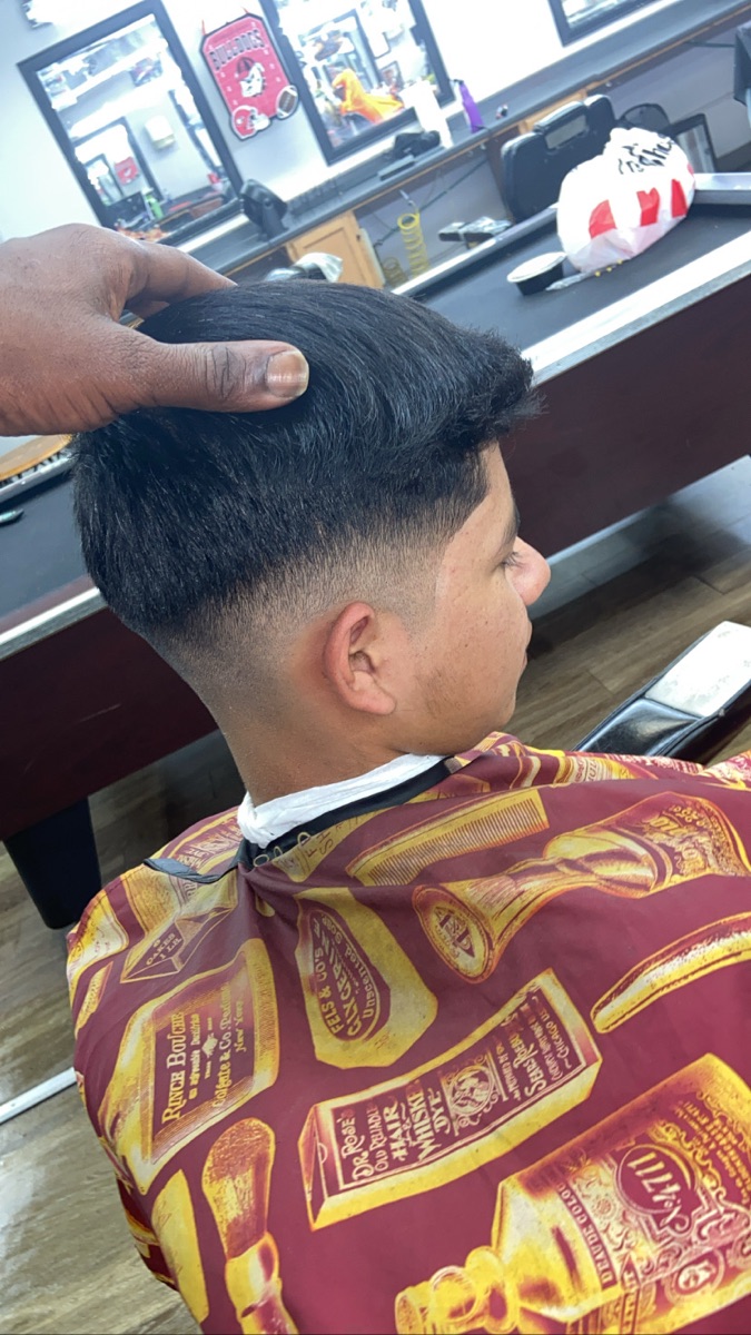 Tapered fade from the back, blended clean into the neckline